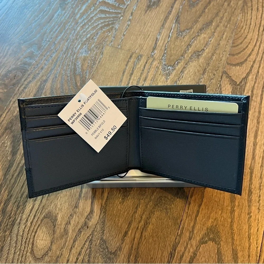 NWT Perry Ellis navy slim bifold leather wallet in box.